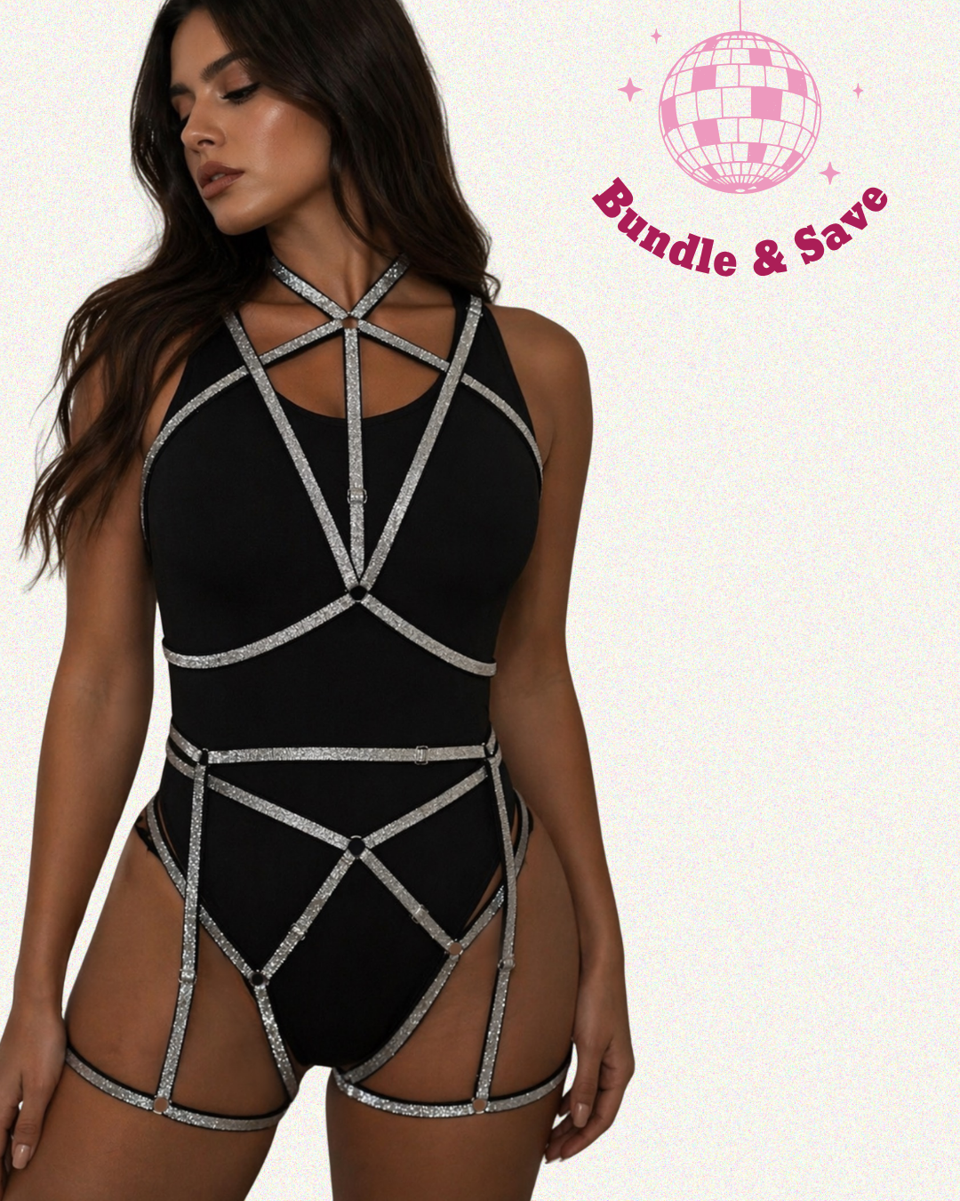 Model wearing black bodysuit and silver strap body harness